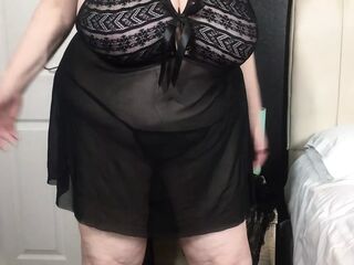 Hefty grannie boobies in and out of a handsome dark-hued negligee